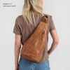 image:imageThe Sak Geo Sling Backpack in Crochet Single Sling Shoulder Strap BlackTobacco